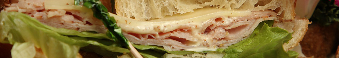Eating Sandwich at Kavarna restaurant in Decatur, GA.